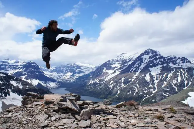 Hiker Jumping in Glacier National Park