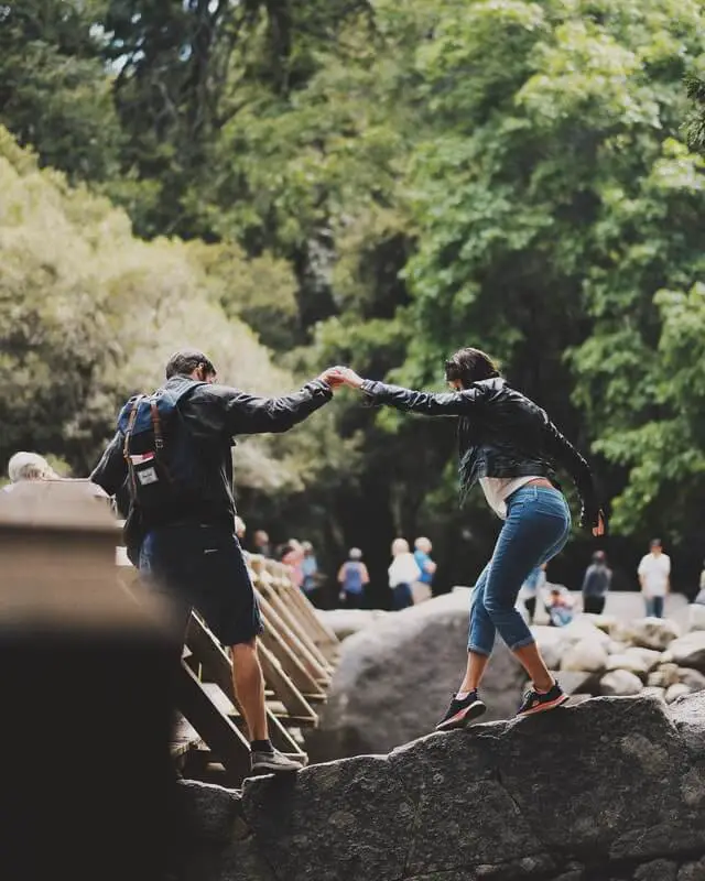 hikers on rocks near yosemite falls