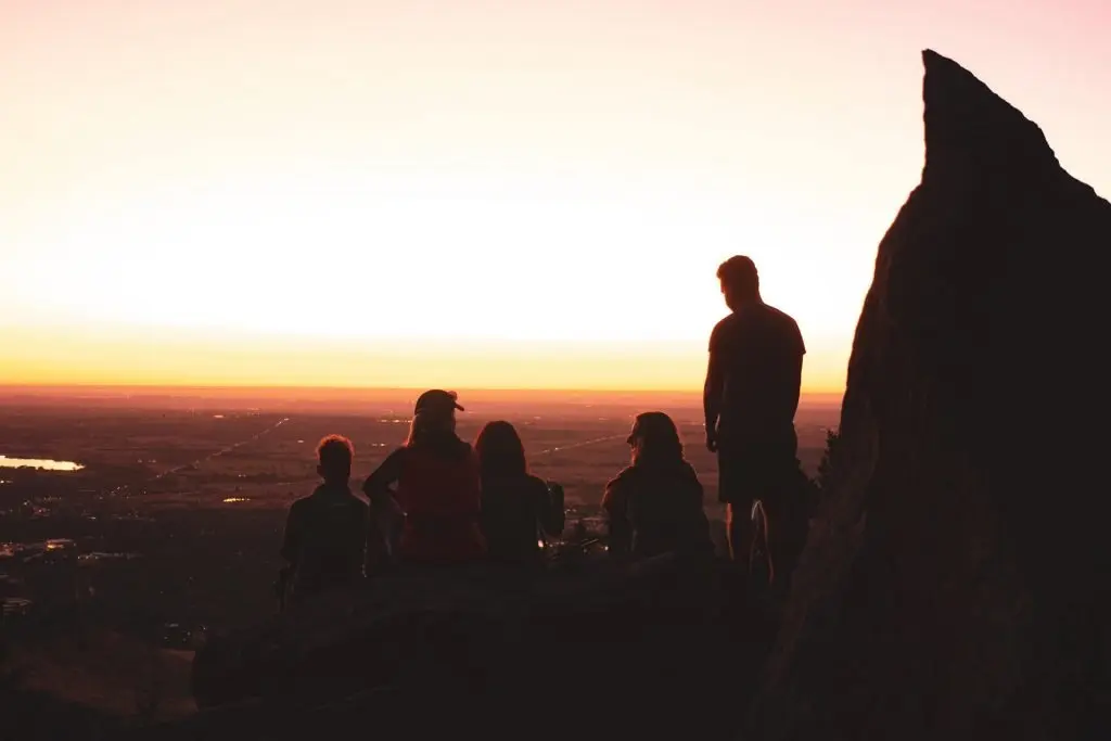 hikers watching sunset