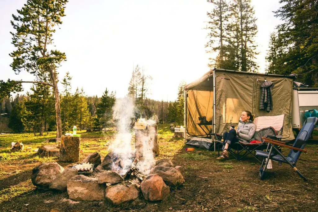 hiker enjoying campsite fire