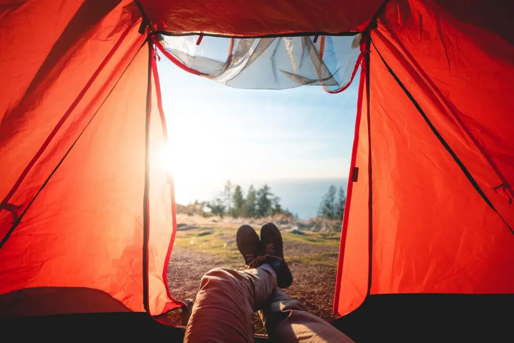 Hiker laying down in tent