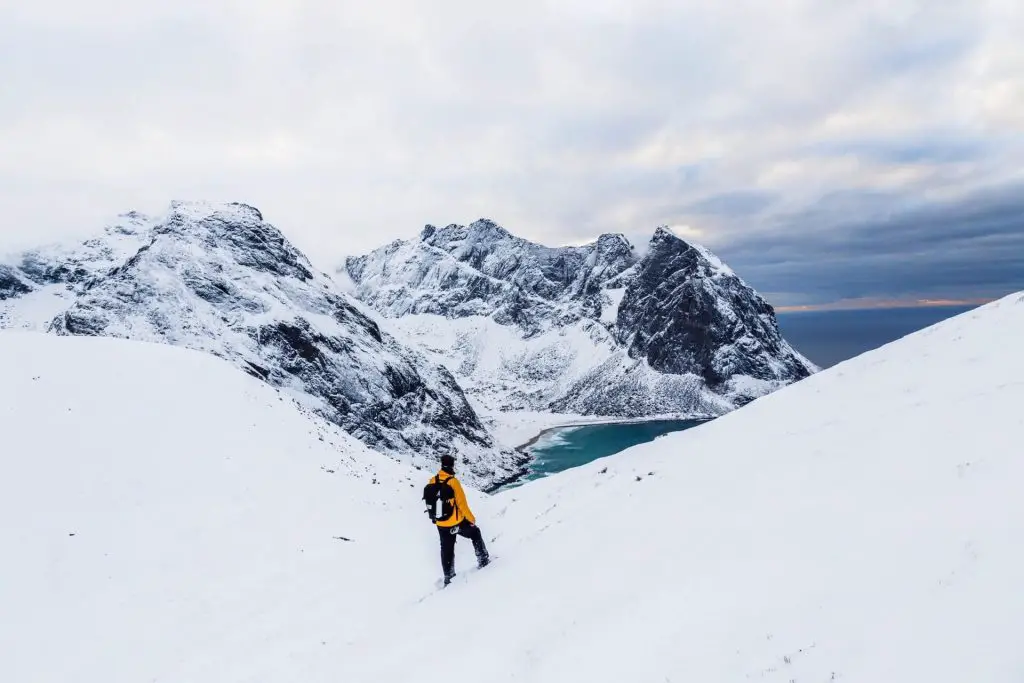 hiker enjoying snowy mountain views