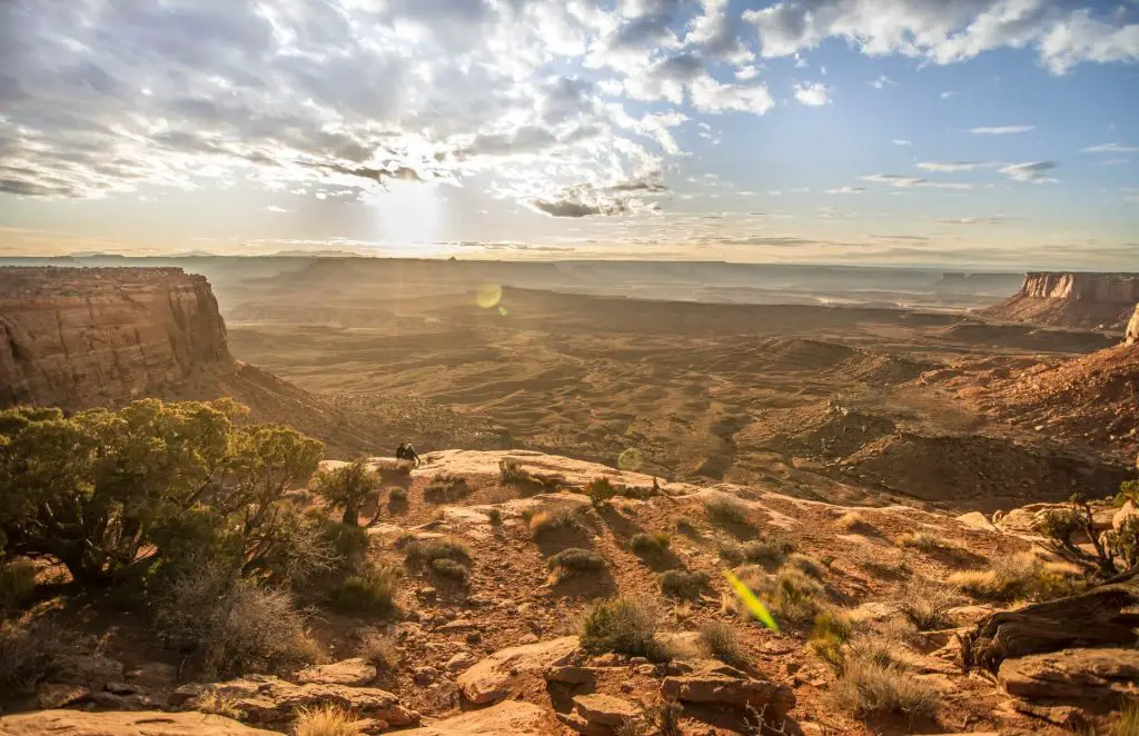 two hikers sitting in canyonlands national park