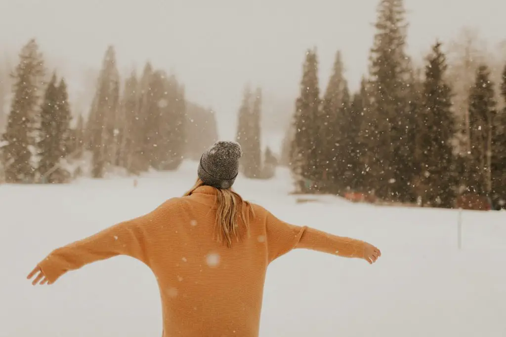 hiker wearing beanie in the snow