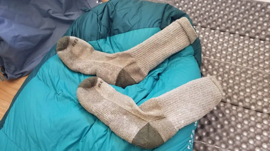 wool socks on sleeping bag