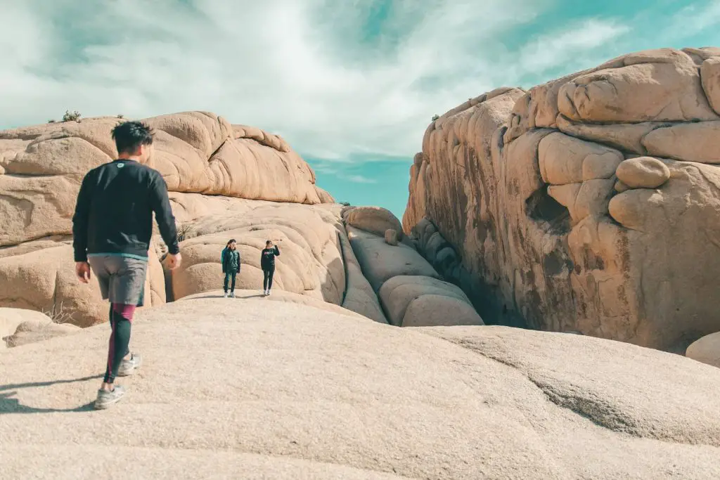 hikers wearing long pants and long sleeves in canyon