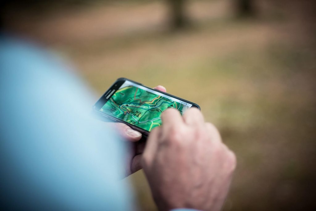 person using smartphone outdoors