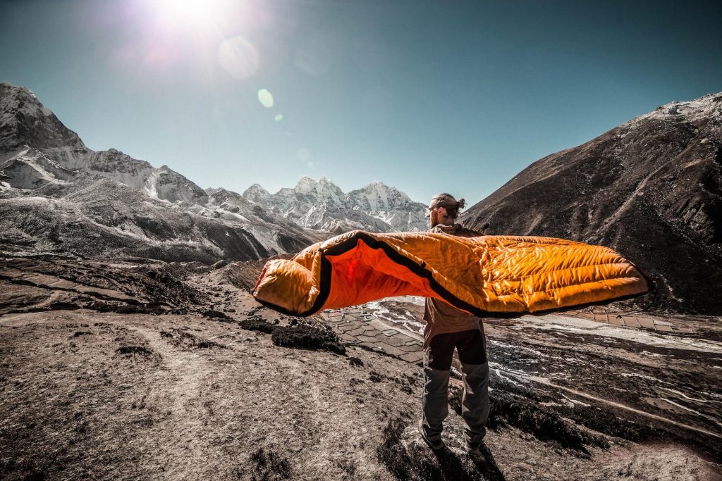 person airing out sleeping bag