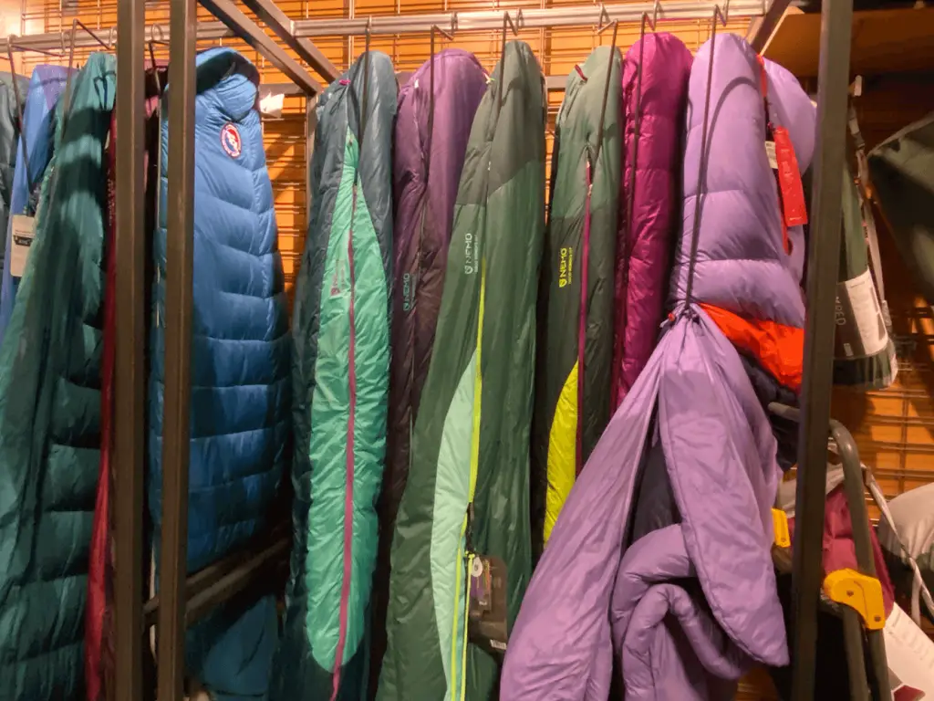 sleeping bags hung on store rack