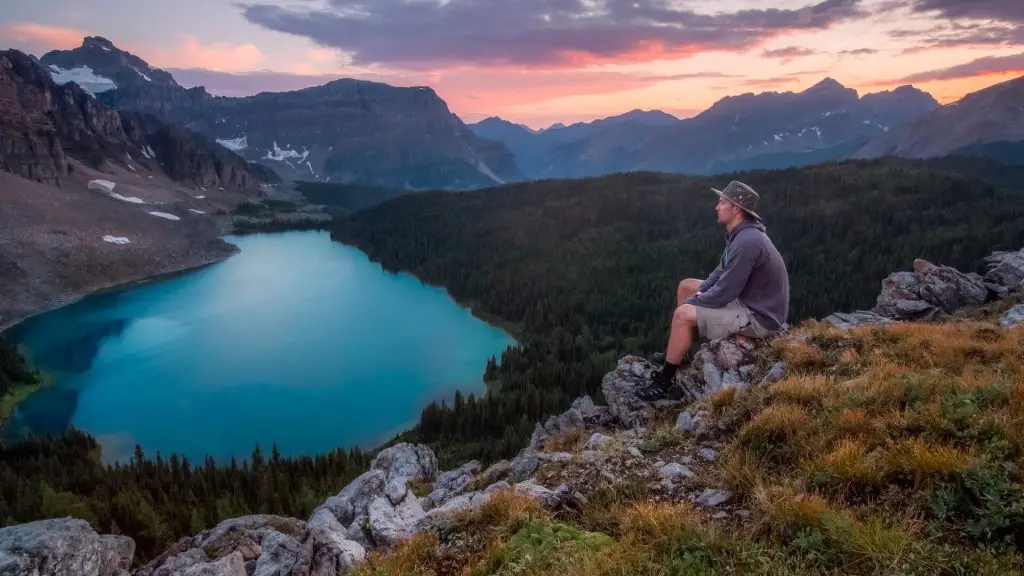 hiker taking a break on rocks