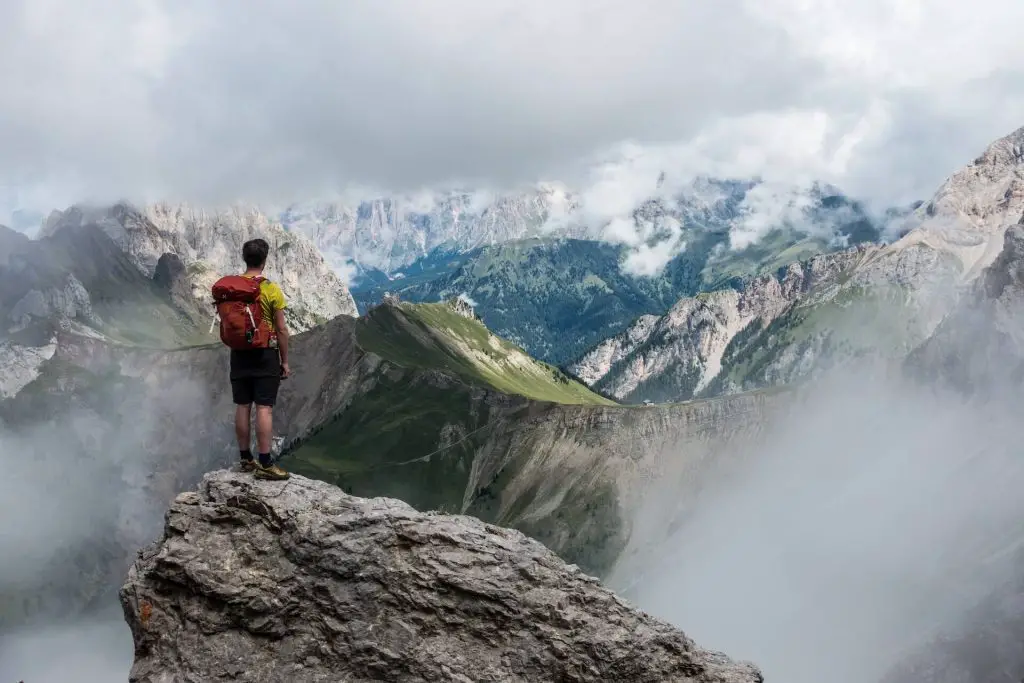 hiker staring off at mountains