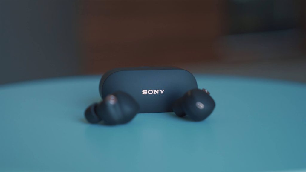 black sony earbuds on desk